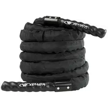 Coiled black Valor Fitness battle rope with handles, ready for rope training exercises in a gym setting.